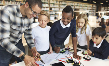 teacher showing electrical experiment